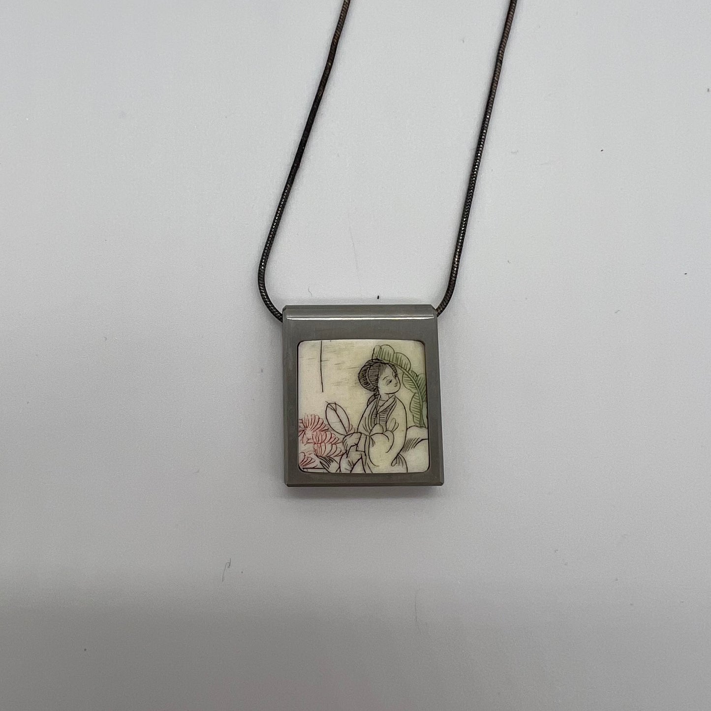 Silver Chain with Image of Woman Pendant